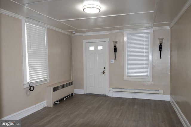 entryway featuring baseboard heating, radiator heating unit, dark wood-type flooring, and ornamental molding