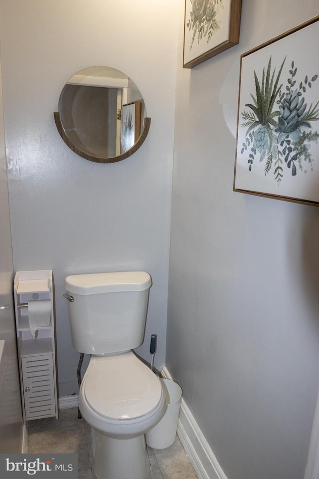 bathroom featuring tile patterned floors and toilet