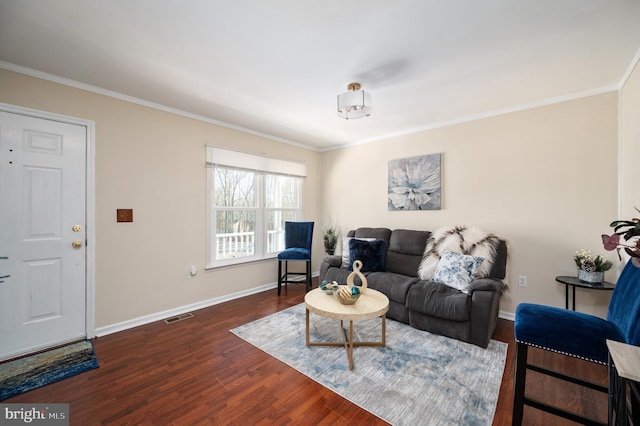 living room with crown molding and dark hardwood / wood-style flooring