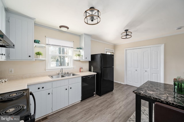 kitchen with crown molding, sink, black appliances, light hardwood / wood-style flooring, and white cabinets