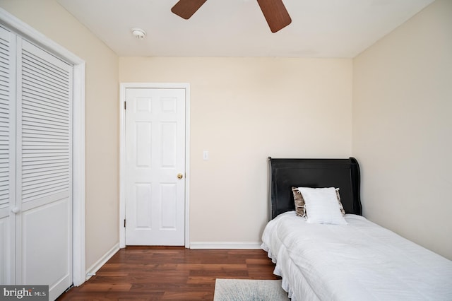 bedroom with ceiling fan and dark wood-type flooring