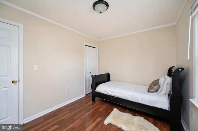 bedroom featuring dark hardwood / wood-style flooring and ornamental molding