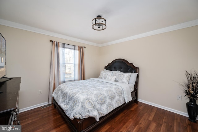 bedroom featuring dark hardwood / wood-style floors and ornamental molding