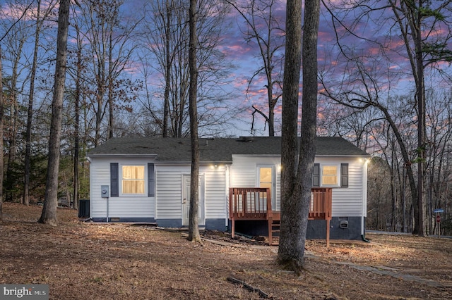 view of front of house with central AC unit and a deck