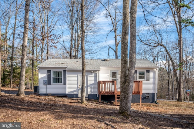 view of front facade with central AC and a deck