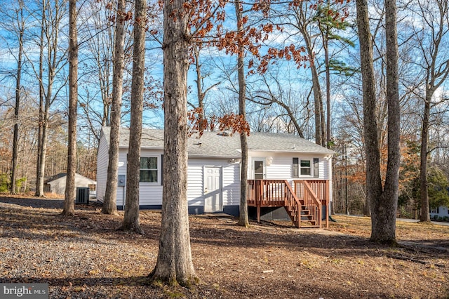 rear view of property with a wooden deck