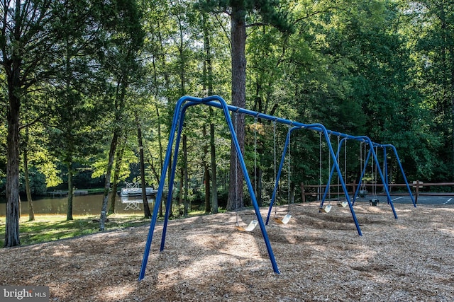 view of playground featuring a water view