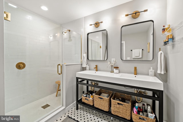 bathroom featuring vanity and a shower with door