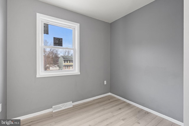 spare room featuring light wood-type flooring