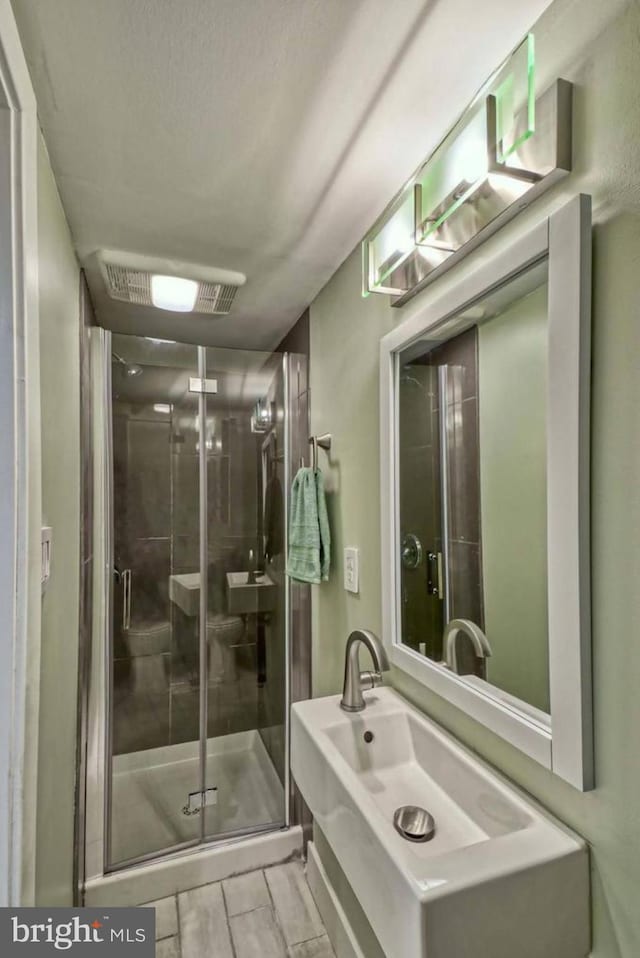 bathroom with an enclosed shower