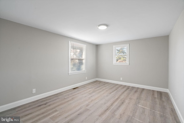 unfurnished room featuring light hardwood / wood-style floors