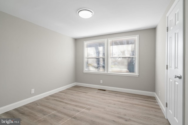 unfurnished room featuring light hardwood / wood-style flooring