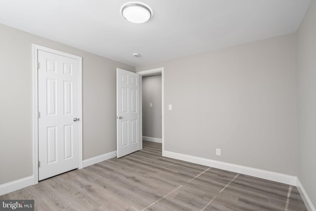 unfurnished bedroom with light hardwood / wood-style flooring