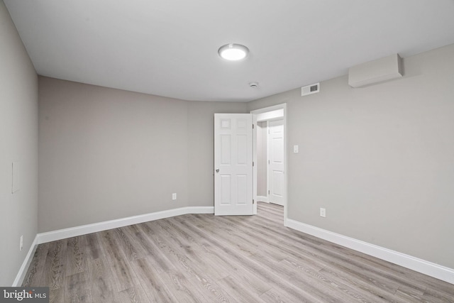 empty room with light hardwood / wood-style floors