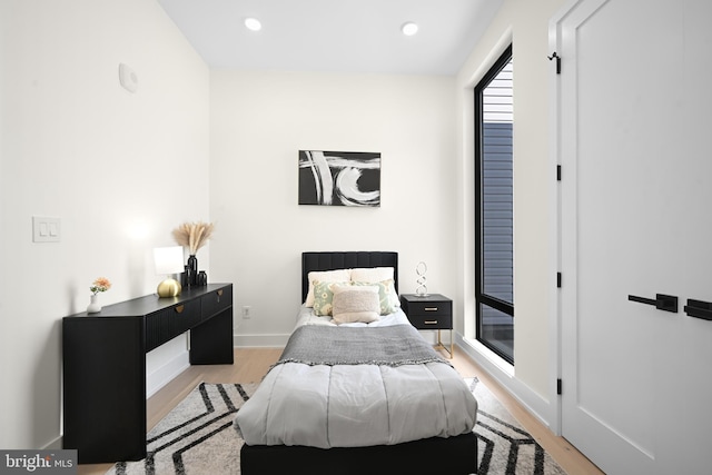 bedroom with light hardwood / wood-style flooring