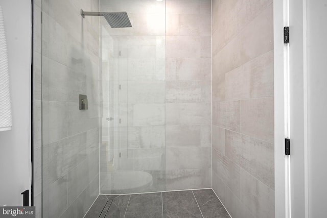 bathroom with a tile shower