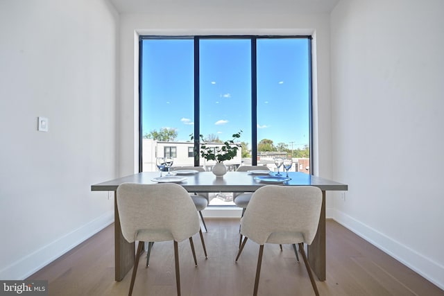 dining area with hardwood / wood-style floors