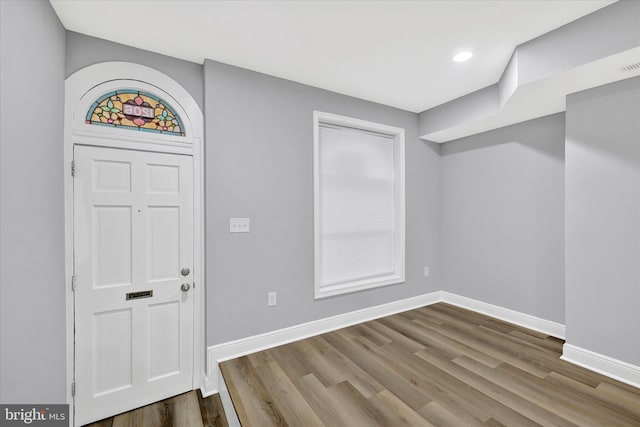 entryway with hardwood / wood-style floors