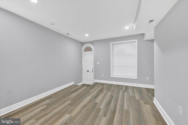 empty room featuring hardwood / wood-style flooring