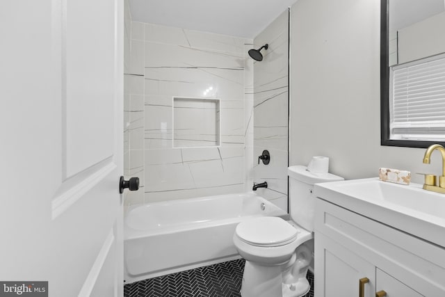 full bathroom featuring toilet, tile patterned floors, vanity, and tiled shower / bath combo