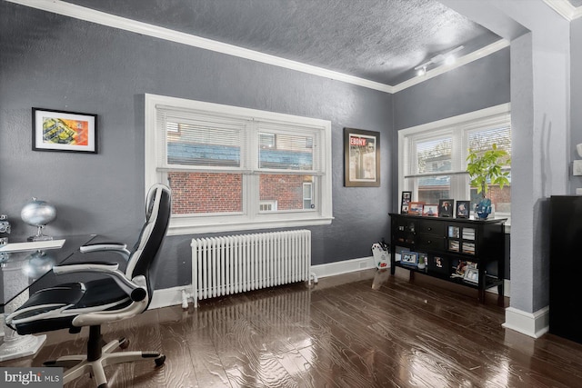 office with a textured ceiling, crown molding, radiator, and dark hardwood / wood-style flooring