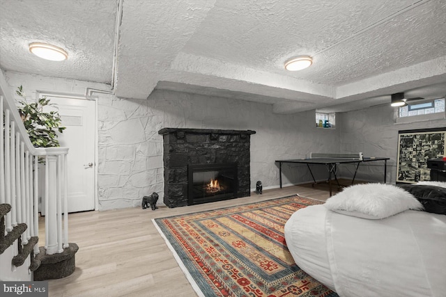 living room with a fireplace and hardwood / wood-style floors