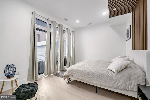 bedroom with light hardwood / wood-style floors