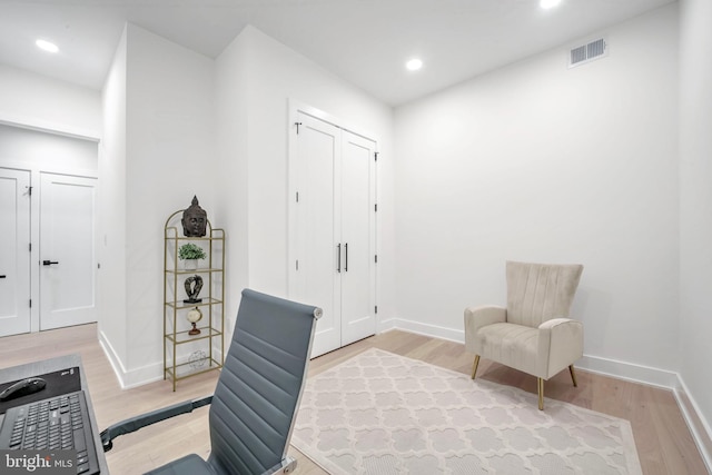 living area with light hardwood / wood-style flooring