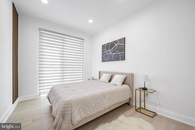 bedroom with light hardwood / wood-style flooring