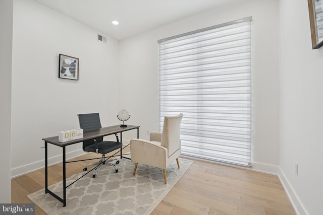 office space featuring light hardwood / wood-style floors