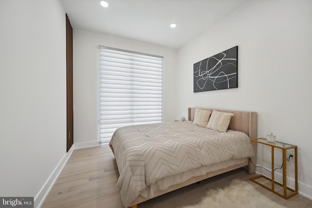 bedroom with light hardwood / wood-style flooring