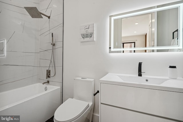 full bathroom with tiled shower / bath, vanity, and toilet