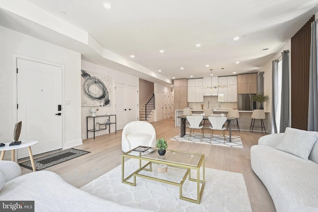 living room with light hardwood / wood-style flooring