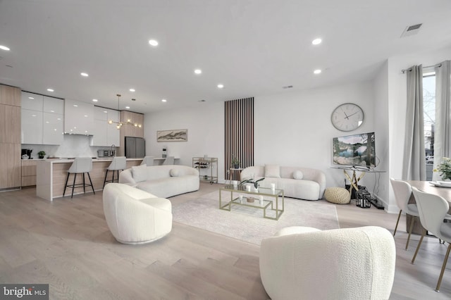 living room with light hardwood / wood-style flooring