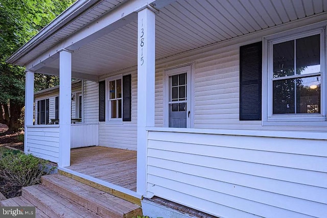 wooden terrace with a porch