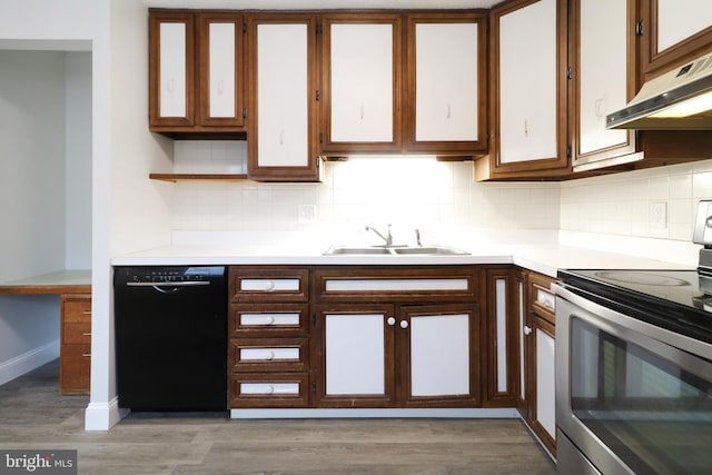 kitchen with sink, black dishwasher, light hardwood / wood-style floors, and stainless steel electric range