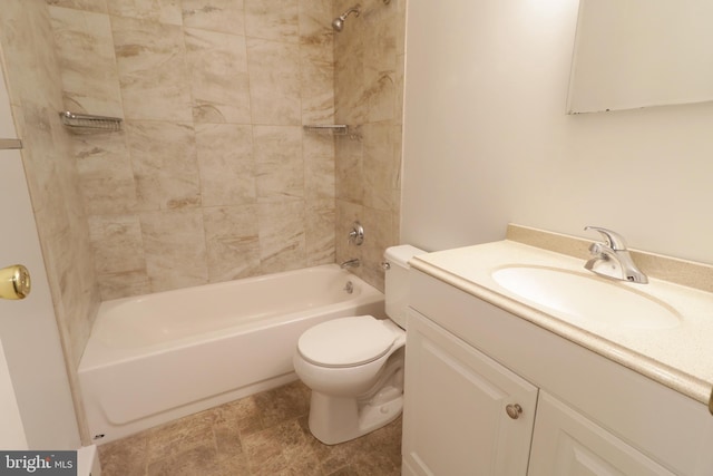 full bathroom featuring vanity, toilet, and tiled shower / bath combo