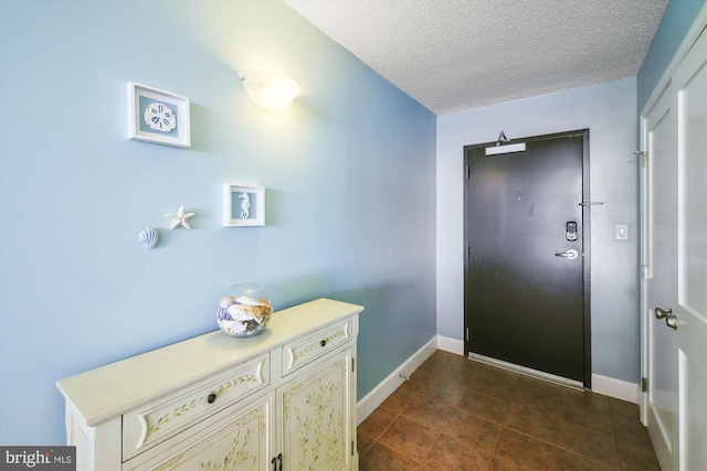 entrance foyer with a textured ceiling