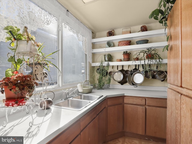 kitchen featuring parquet floors and sink