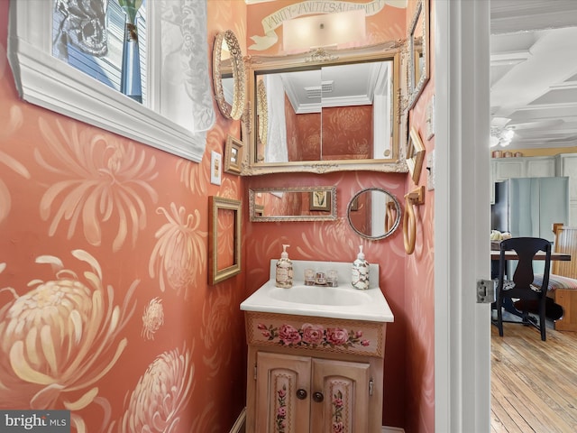 bathroom featuring crown molding and vanity