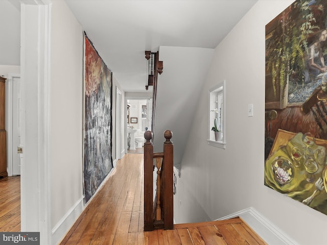 corridor featuring hardwood / wood-style floors