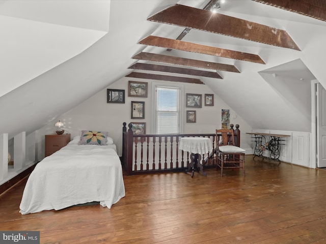 bedroom with lofted ceiling and dark wood-type flooring