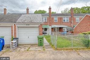 townhome / multi-family property featuring a garage