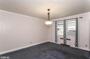 empty room featuring ornamental molding