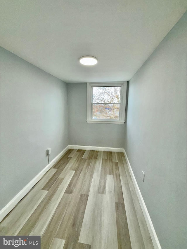 empty room with light wood-type flooring