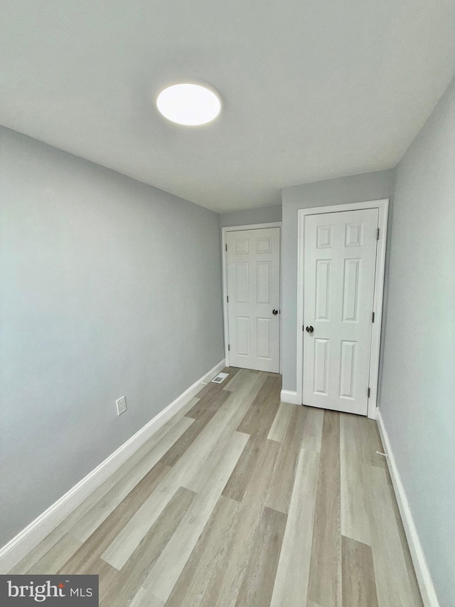 unfurnished bedroom with light hardwood / wood-style flooring