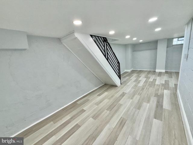 basement featuring light hardwood / wood-style floors