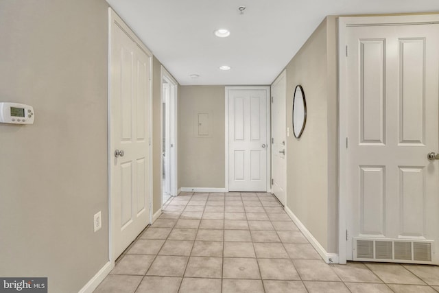 hall with light tile patterned flooring