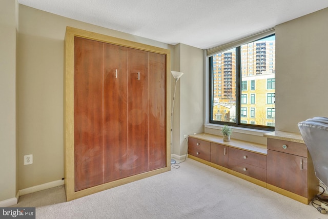 carpeted bedroom featuring a textured ceiling