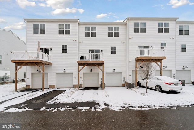 exterior space featuring a garage and central air condition unit